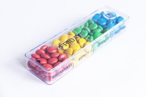 Pill box filled with m&m's